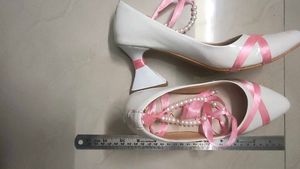 Chic White Heels with Pink Ribbon Detail