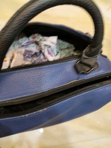 Stylish Blue Handbag with Eyelet Details