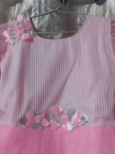 Stylish baby pink colored party wear frock