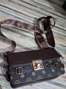Stylish Brown Crossbody Bag with Monogram Strap