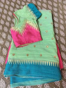 Green Saree with Pink and Teal Blouse