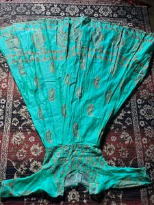 Beautiful Teal Ethnic Gown with Gold Print know an