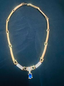 Elegant Gold Necklace with Blue Stone