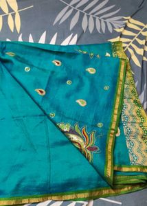 Elegant Teal Saree with Embellished Detailing