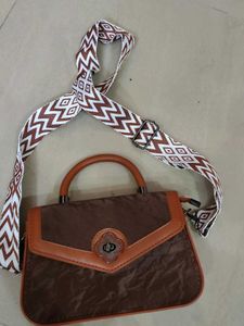 Chic Brown Handbag with Trendy Strap