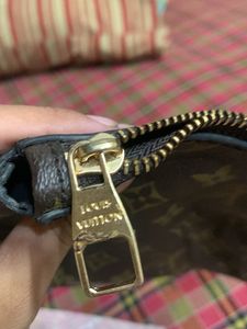 Louis Vuitton pouch Authenticity Not Verified