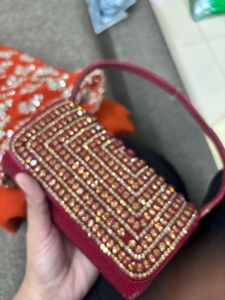 Red Embroidered saree and Blouse with Handbag