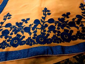 Vibrant Orange Saree with Floral Border