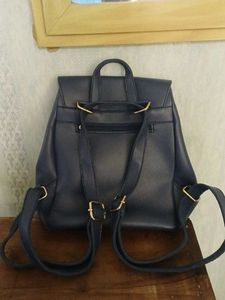 Blue leatherite backpack with magnetic shutters