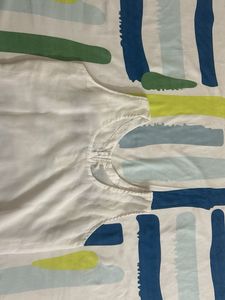White Sleeveless Kurta with Red Buttons