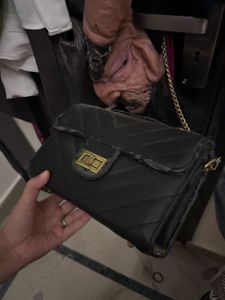 black sling bag puffed and spacious