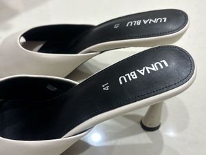 Elegant White Heeled Mules