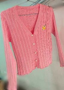 A PASTEL PINK EMBROIDERED CARDIGAN