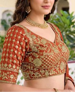 Elegant Orange Embroidered Lehenga Choli