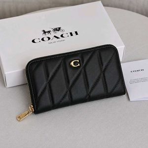 Coach Accordion Zip wallet featuring pillow quilti