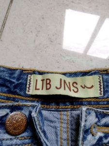 Distressed Blue Denim Jeans