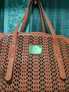 Chic Orange Laser-Cut Handbag