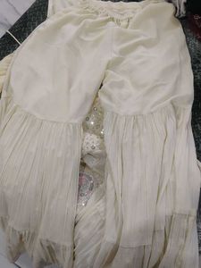 Elegant Cream Kurta Set with Intricate Embellishme