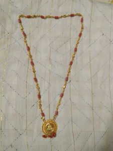 Elegant Gold Chain with Red Beads