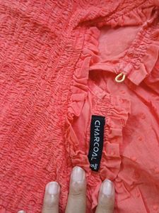 Coral Smocked Peplum Top