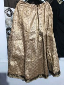 black kurti with golden lehga
