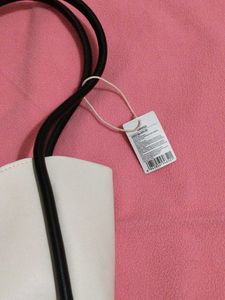Chic White Tote Bag with Black Trim