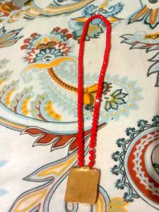 Red Beaded Necklace with Gold Pendant