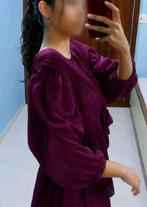 A beautiful decent purple top with florry sleeves