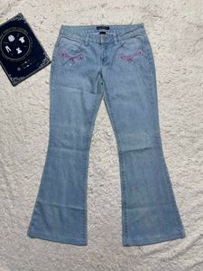 Light Wash Flared Jeans with Embellishments