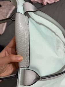Stylish Teal Hobo Bag with Flower Accent