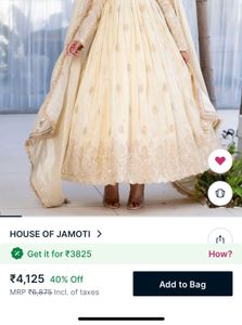 White Anarkali suit with golden embriodery
