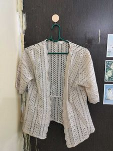 shrug in beige colour