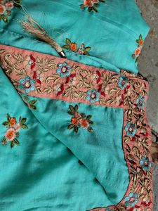 Beautifully Embroidered Teal Saree