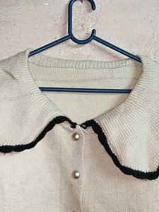 Chic Cream Knit Cardigan with Black Trim