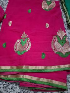 Vibrant Pink Saree with Peacock Motifs
