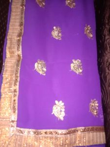 Vibrant Purple Saree with Gold Embellishments