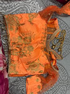 Stunning Orange Embroidered Lehenga Choli