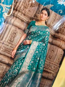 Elegant Teal Saree with Golden Motifs