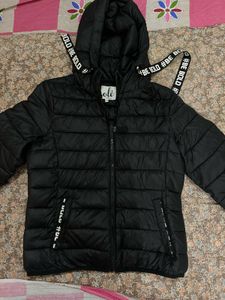 Black Puffer Jacket with "Be Bold" Detail
