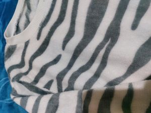 White Velvet Sweater With Black Stripes On It