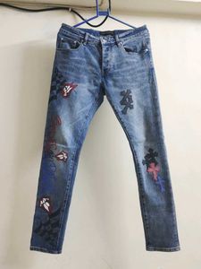 Chrome Hearts cross patch graphic blue jeans