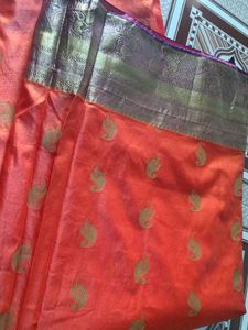 Elegant orange saree  with Gold Motifs