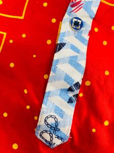 Vibrant Red Boys Polo Shirt with Geometric Print