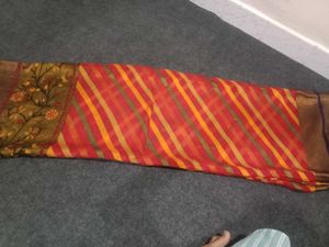 Elegant red yellow leriya Saree with Floral Motifs