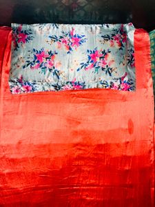 Satin bedcover with floral pillow