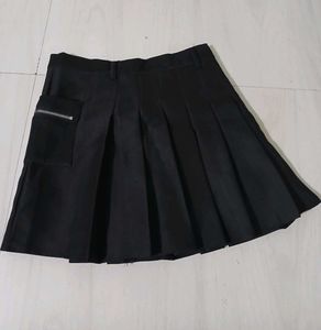 Classic black pleated mini skirt.