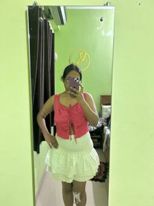 Chic Pink Lace-Up Crop Top with white skirt