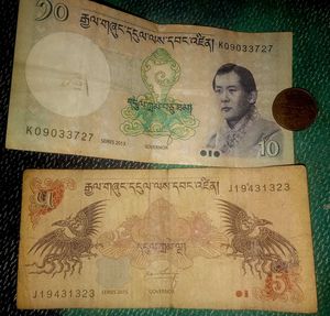 Bhutan 2  notes and  Nepal coin