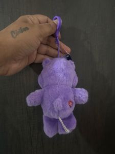 purple Care Bears plush toy keychain featuring