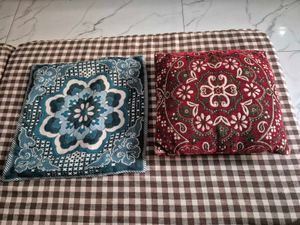 Decorative Red Floral Cushion with Blue Cover